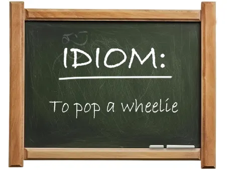 english idiom to pop a wheelie