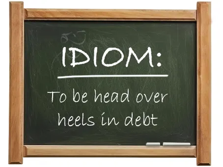 english idiom to be head over heels in debt